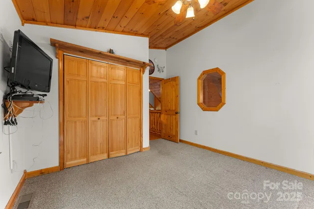 a living room with lots of furniture and a rug