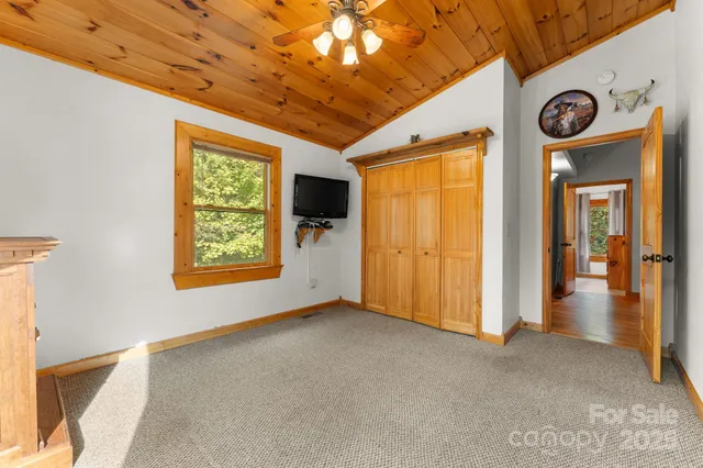 a view of a wooden door with a small yard