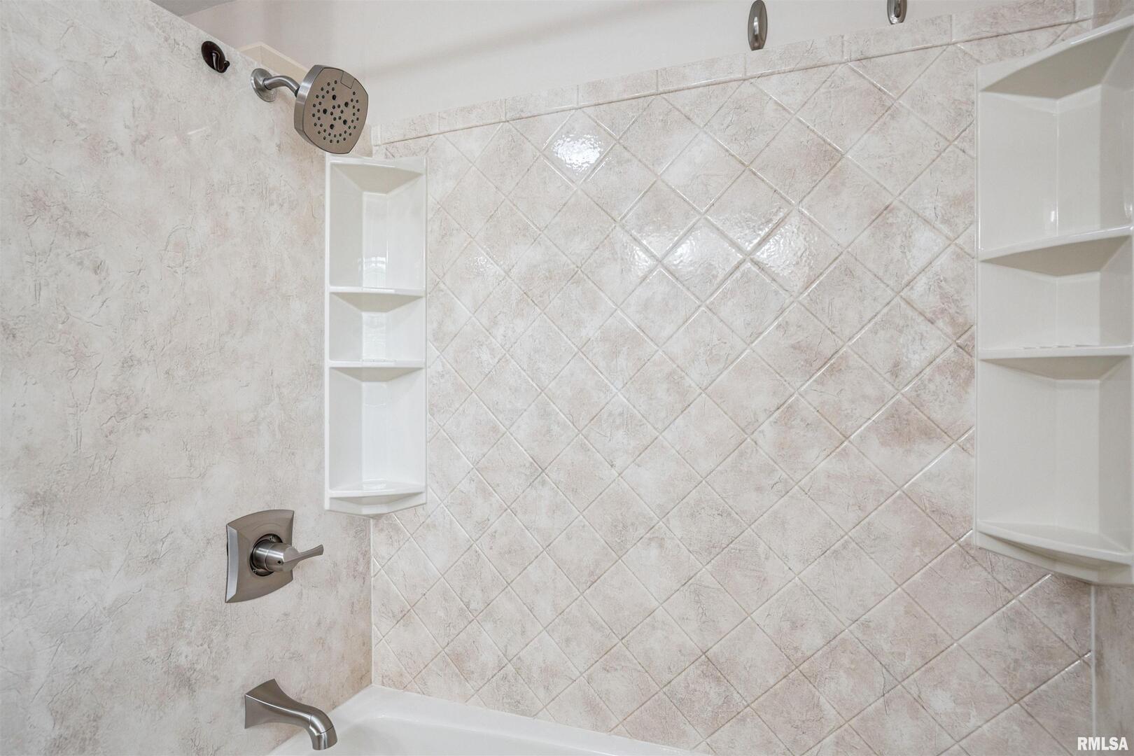 22799 Great River Road Le Claire, IA 52753 - Photo 15 of 48 a bathroom with a shower