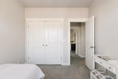 a room with a baby crib and a dresser