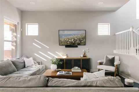 a living room with furniture and window