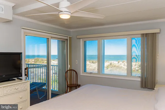 a bedroom with furniture and a flat screen tv