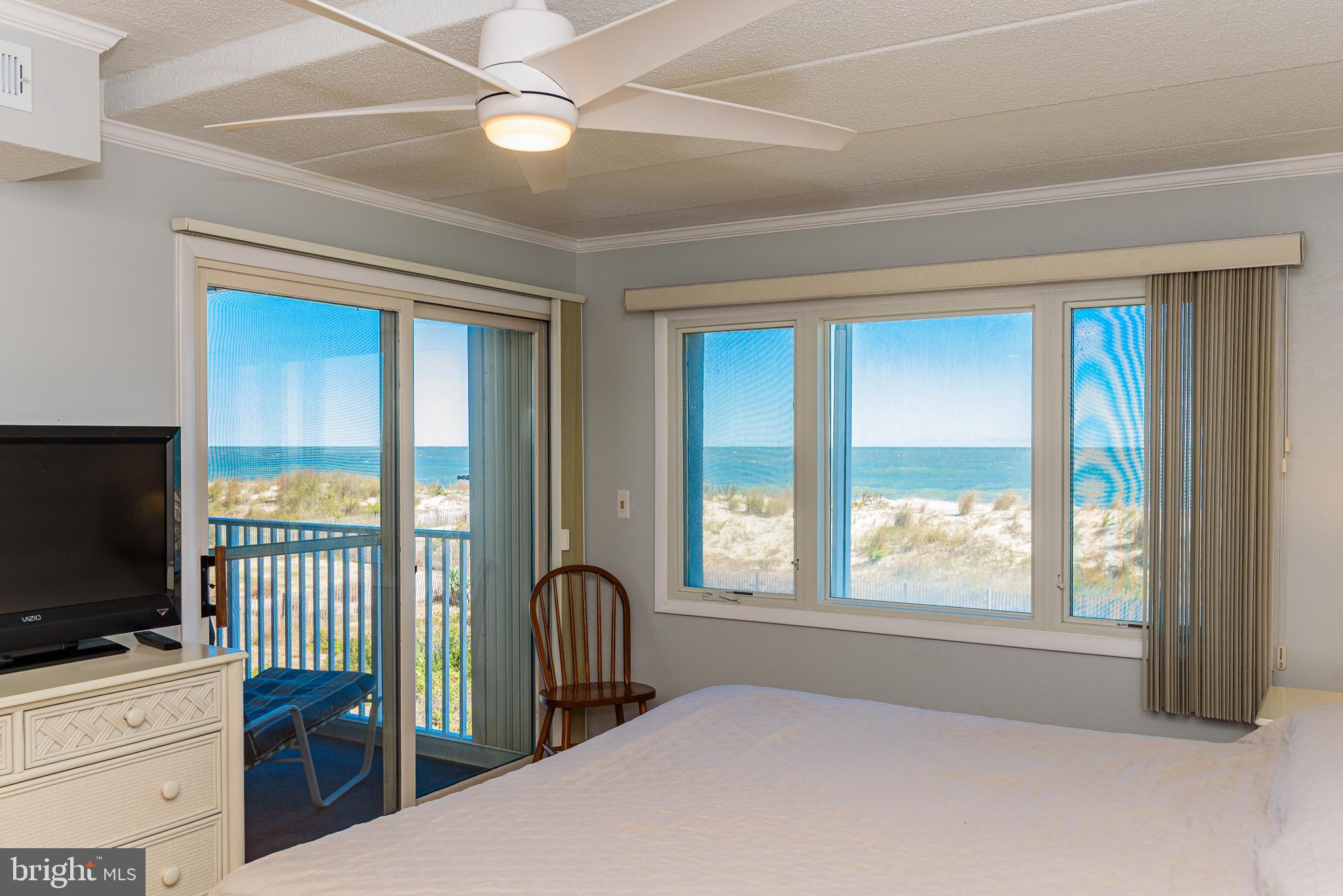 a bedroom with furniture and a flat screen tv