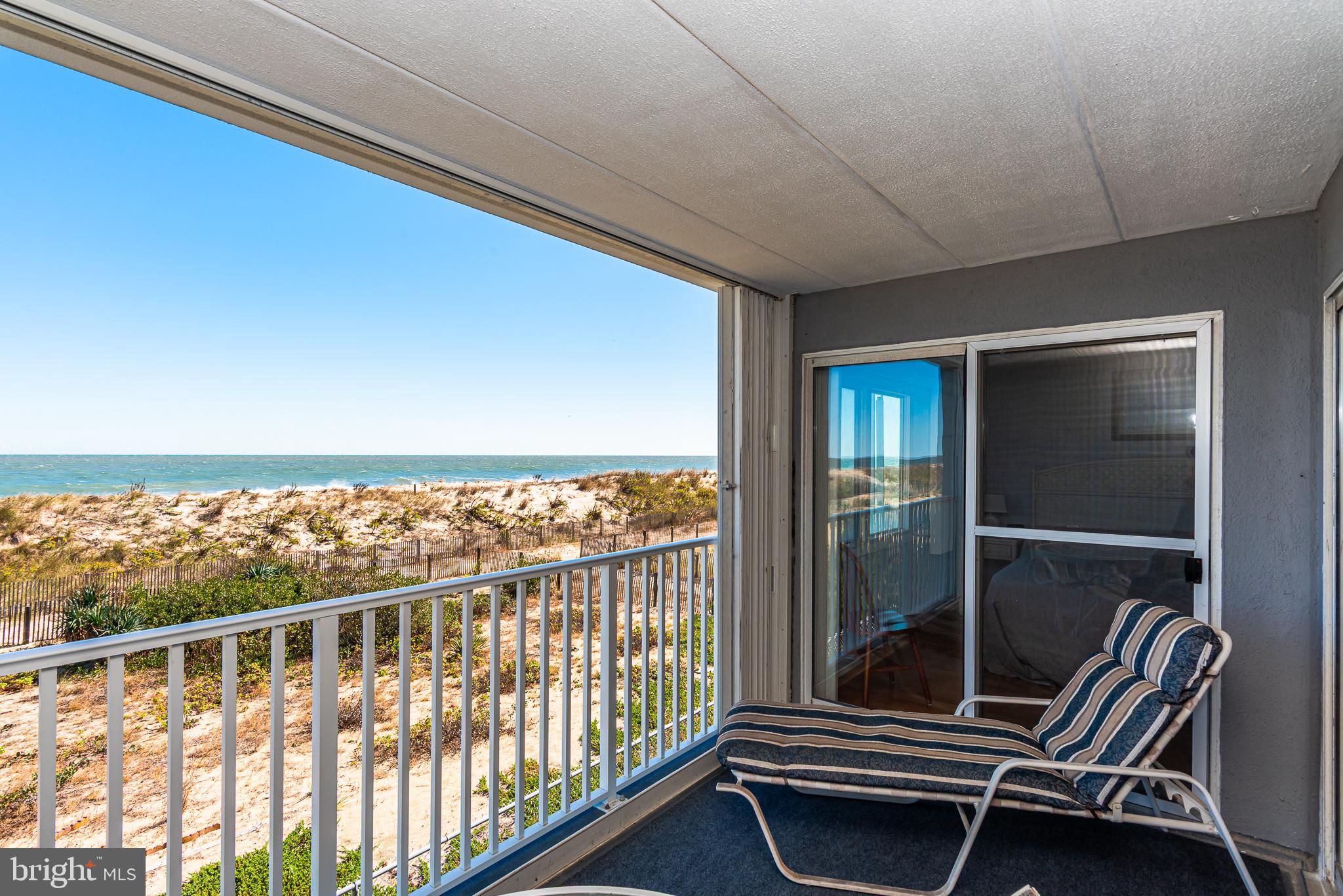 5 77th Street, Unit 102 Ocean City, MD 21842 - Photo 27 of 38 a balcony with chairs