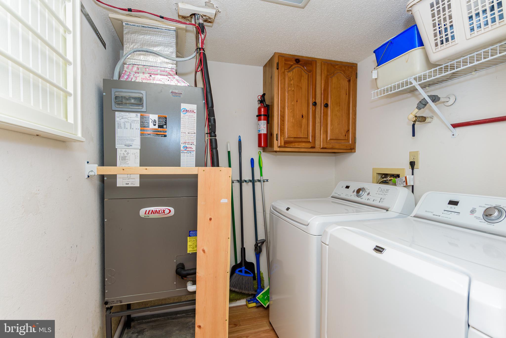 5 77th Street, Unit 102 Ocean City, MD 21842 - Photo 34 of 38 a utility room with dryer and washer