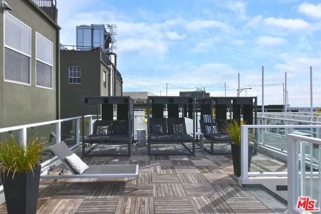 a view of entryway with a front door and wooden floor
