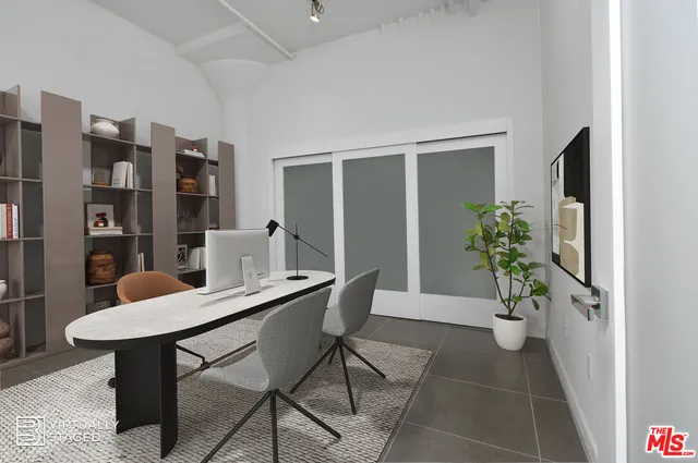 a view of a workspace with furniture