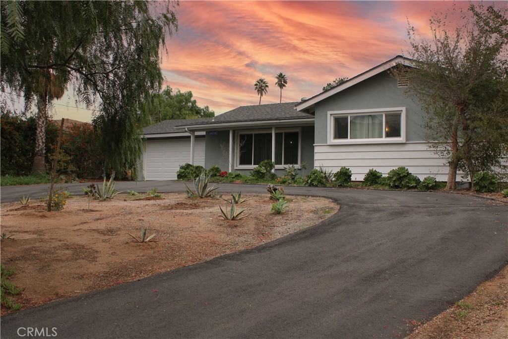 6850 Jurupa Road Riverside, CA 92509 - Photo 1 of 1 a view of a house with backyard and sitting area