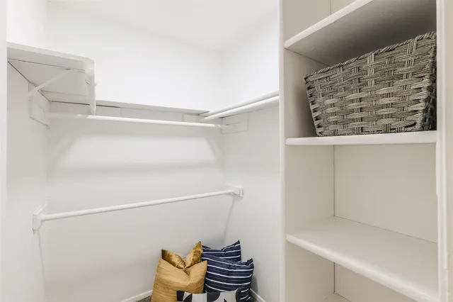 a bathroom with a window and a shower