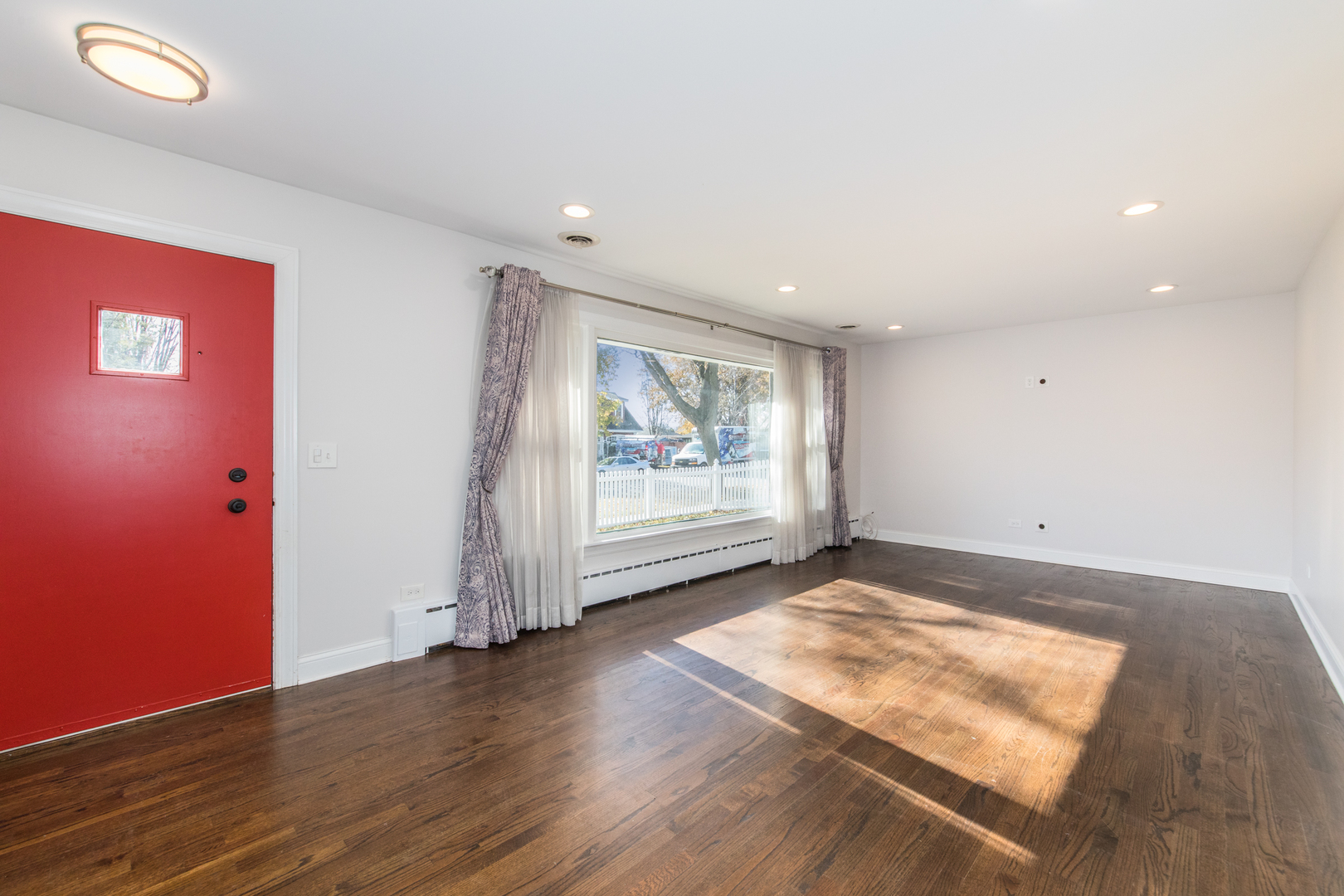 101 North Pine Street Mount Prospect, IL 60056 - Photo 2 of 32 an empty room with wooden floor and window
