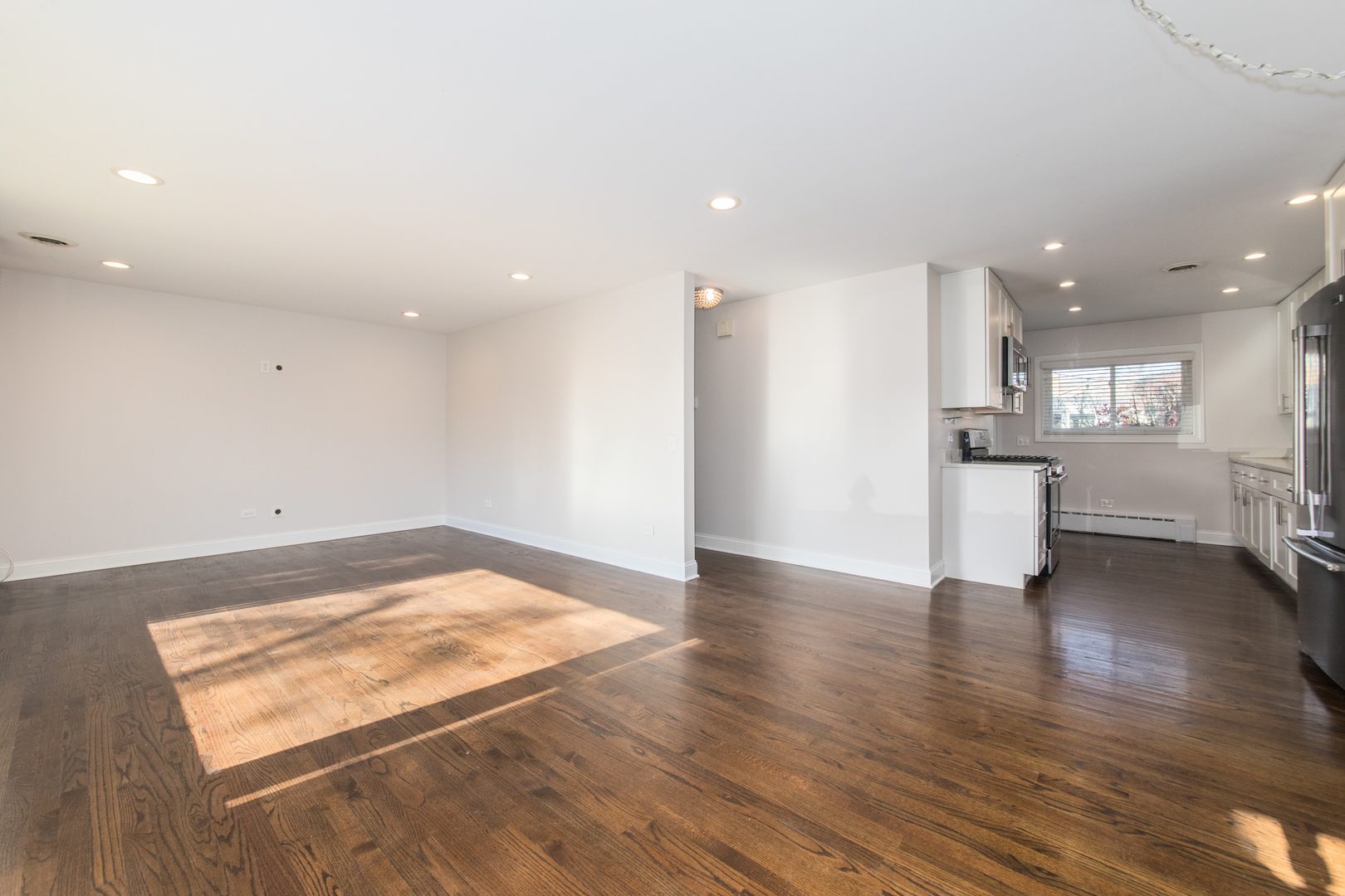 101 North Pine Street Mount Prospect, IL 60056 - Photo 3 of 32 a view of a kitchen with a sink and wooden floor