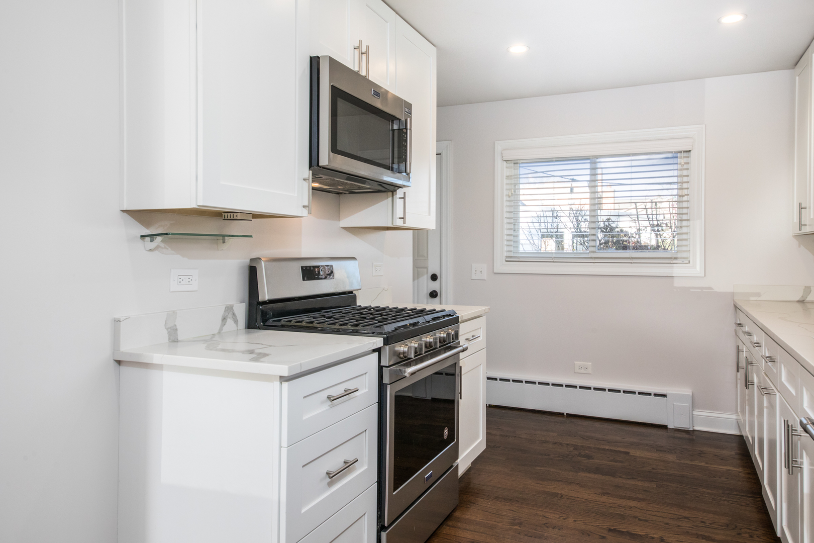 101 North Pine Street Mount Prospect, IL 60056 - Photo 7 of 32 a kitchen with a stove and a microwave