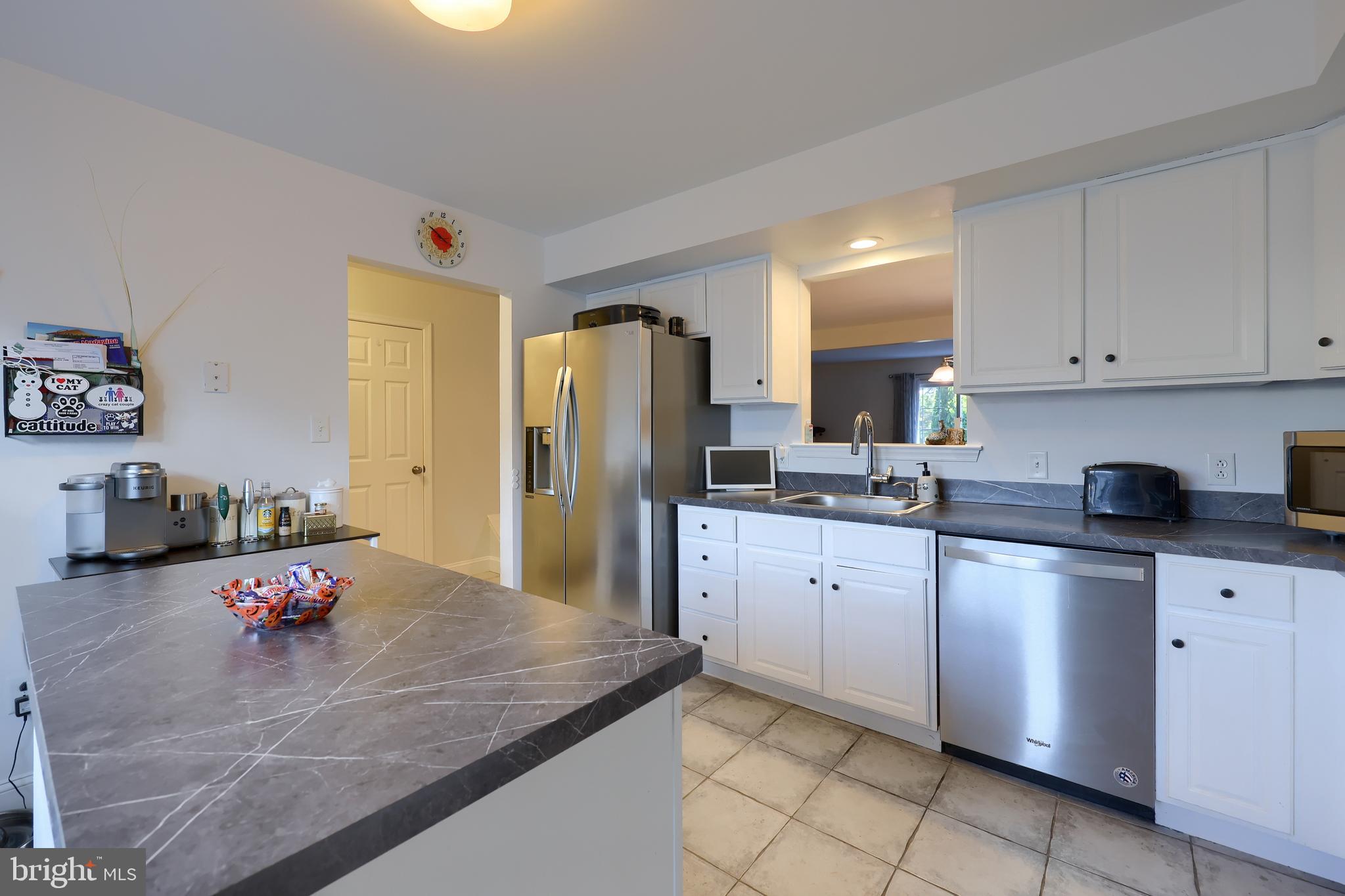 216 Nicole Way Sinking Spring, PA 19608 - Photo 11 of 35 a kitchen with stainless steel appliances granite countertop a sink refrigerator and cabinets