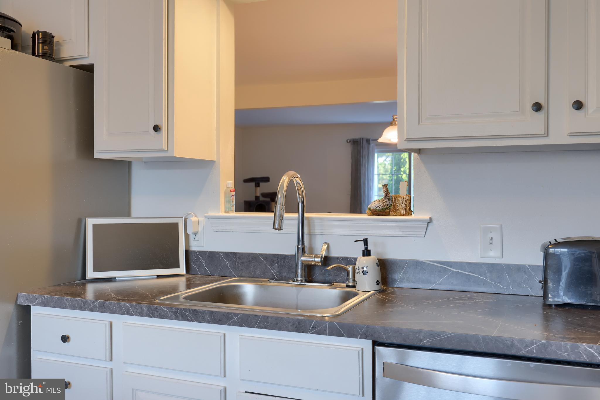 216 Nicole Way Sinking Spring, PA 19608 - Photo 13 of 35 a kitchen with granite countertop a sink and cabinets