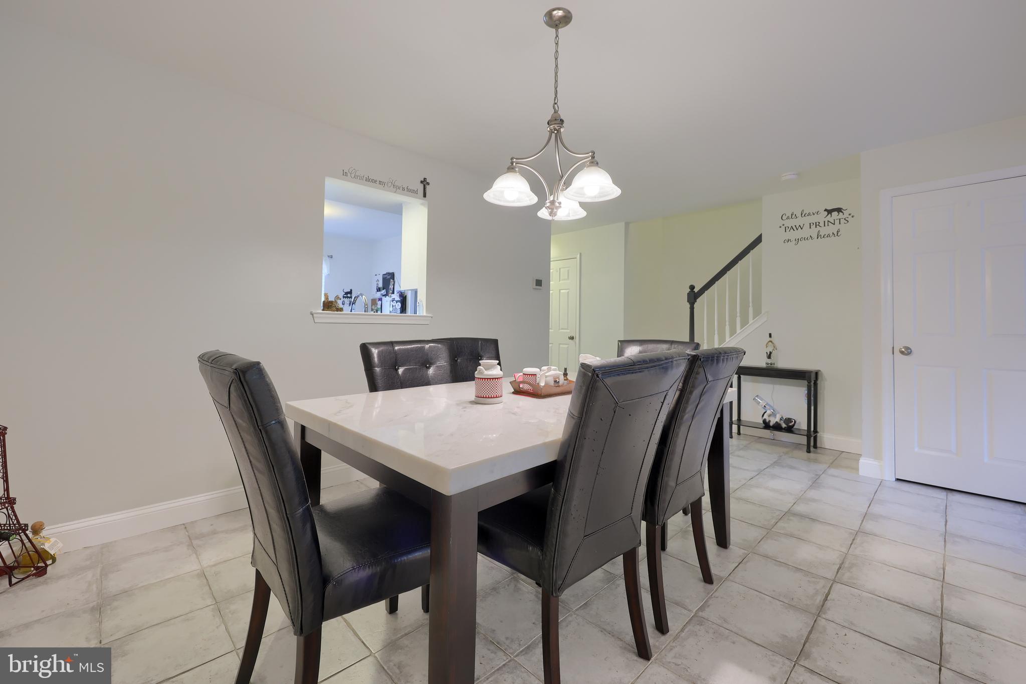 216 Nicole Way Sinking Spring, PA 19608 - Photo 15 of 35 a view of a dining room with furniture and wooden floor