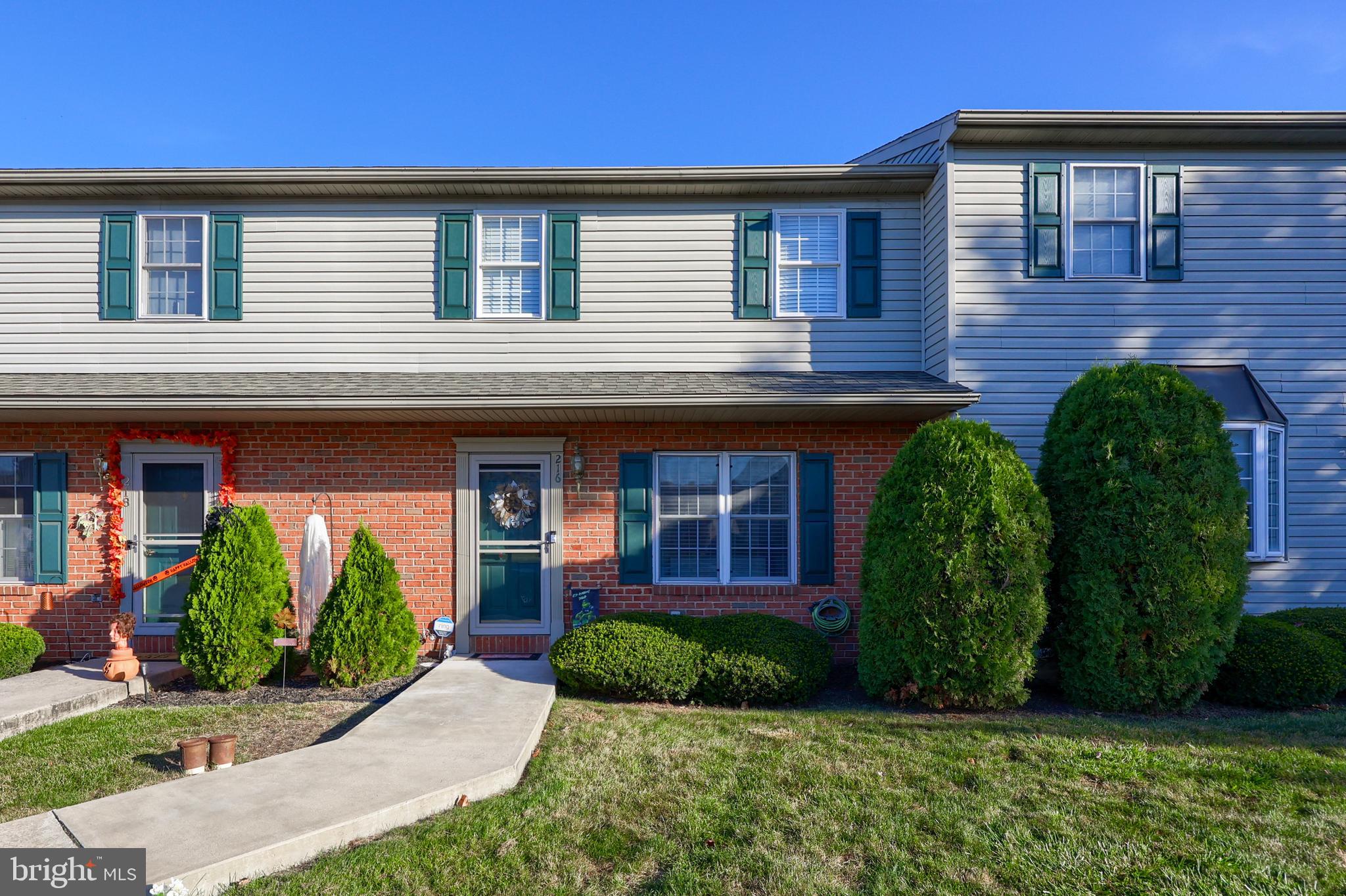 216 Nicole Way Sinking Spring, PA 19608 - Photo 2 of 35 a front view of a house with garden