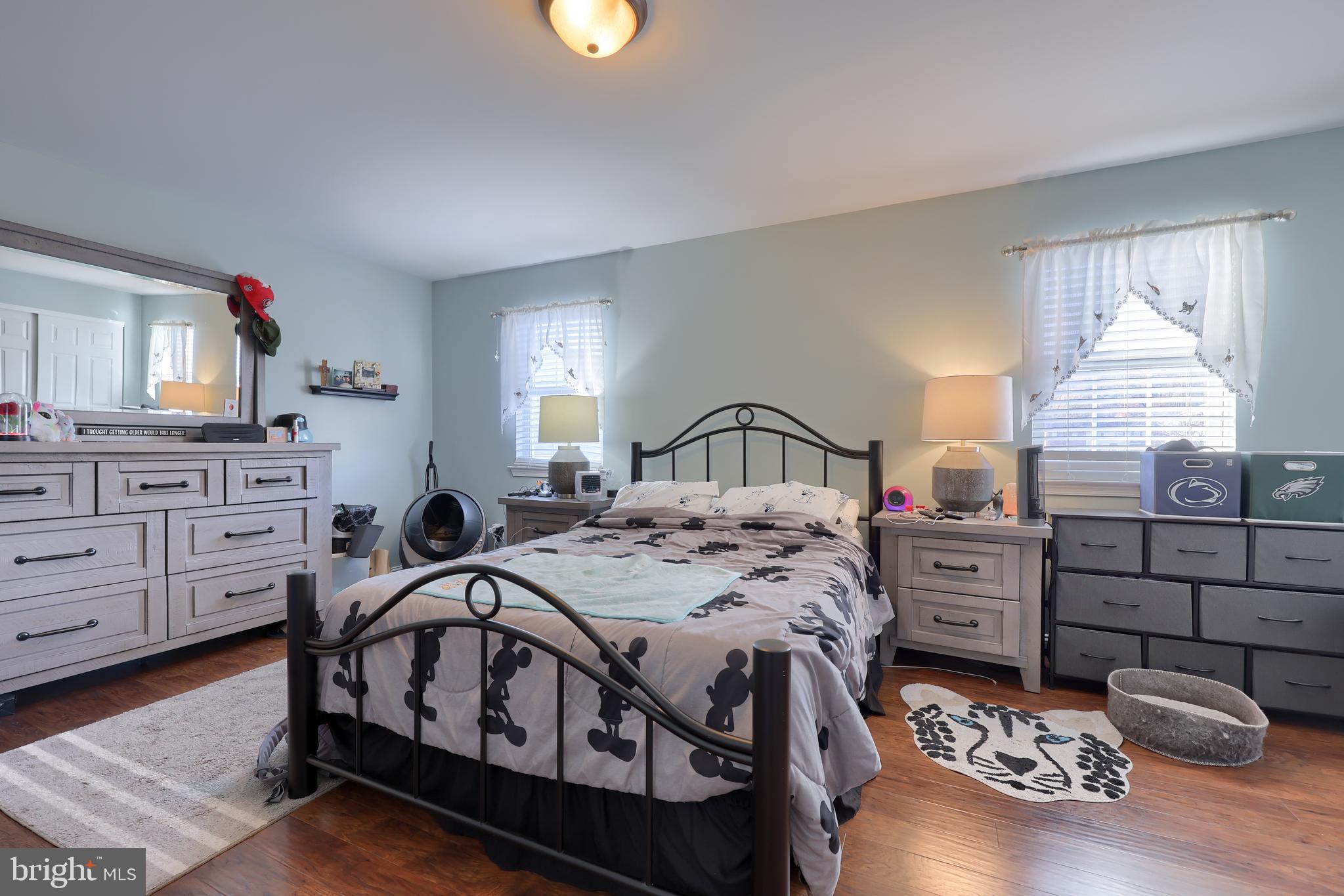 216 Nicole Way Sinking Spring, PA 19608 - Photo 22 of 35 a bedroom with a bed and a dresser