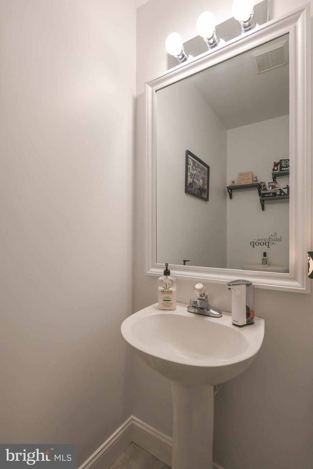 216 Nicole Way Sinking Spring, PA 19608 - Photo 23 of 35 a bathroom with a sink and a mirror