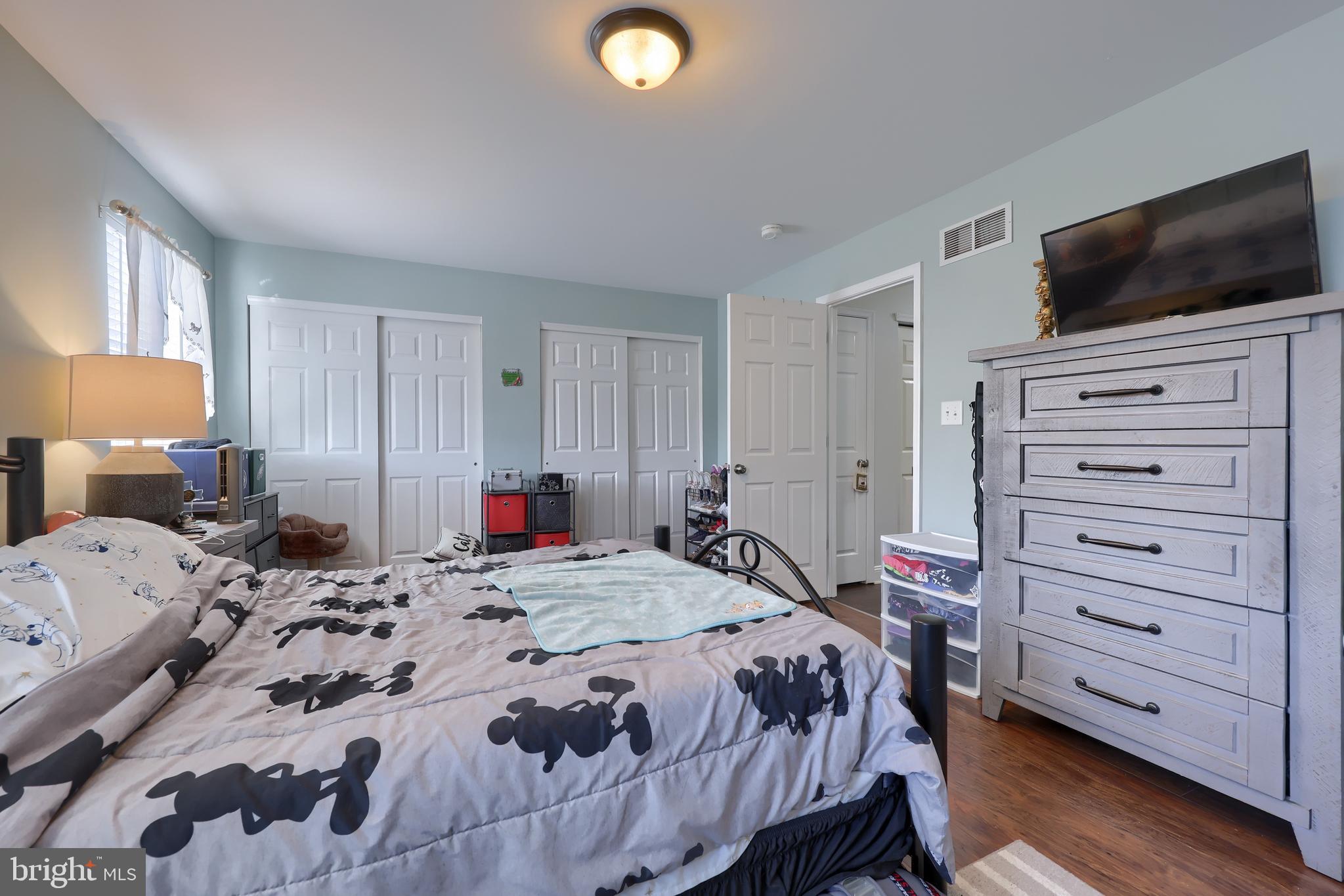 216 Nicole Way Sinking Spring, PA 19608 - Photo 24 of 35 a bedroom with a bed and a flat screen tv