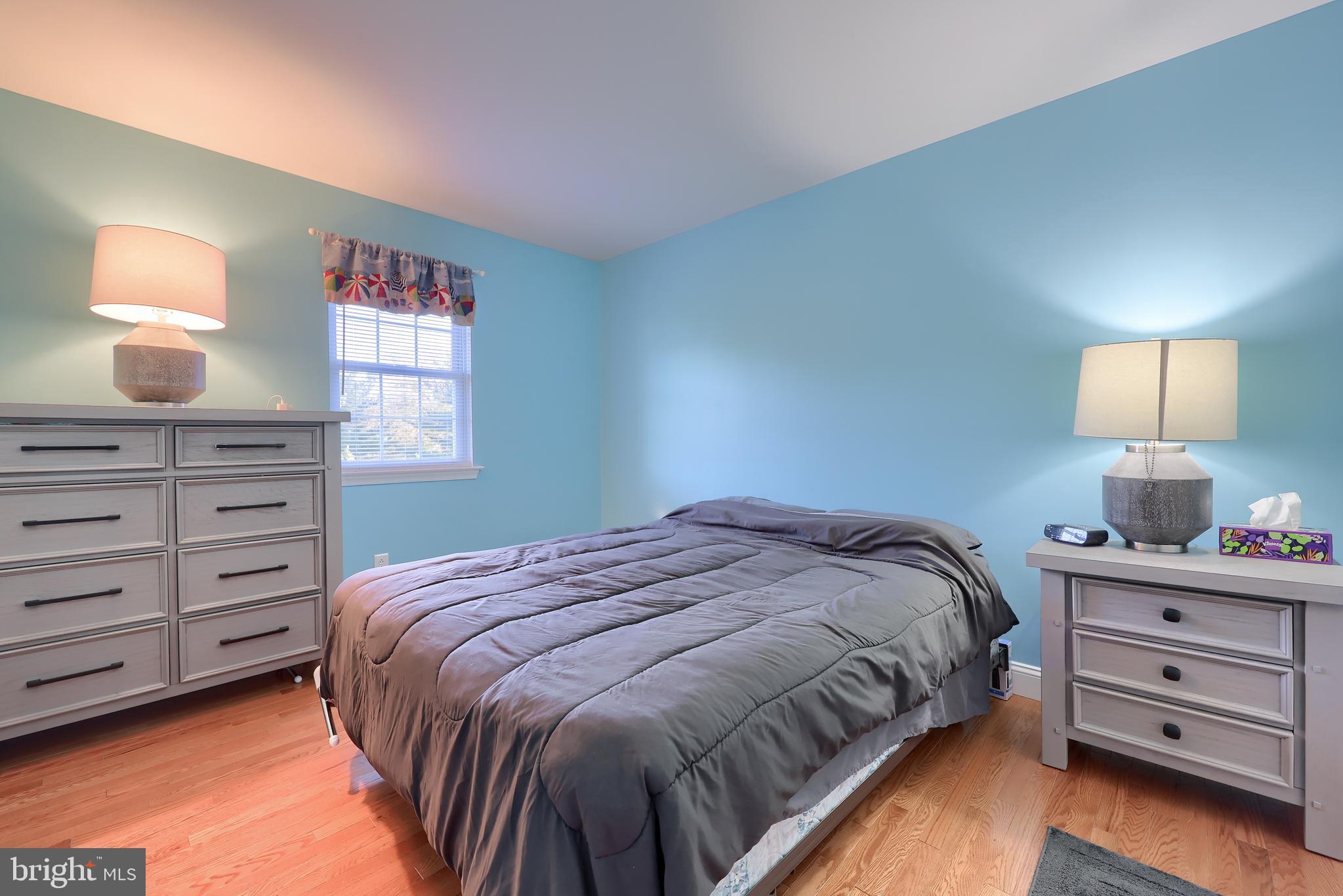 216 Nicole Way Sinking Spring, PA 19608 - Photo 27 of 35 a bedroom with a bed and a dresser
