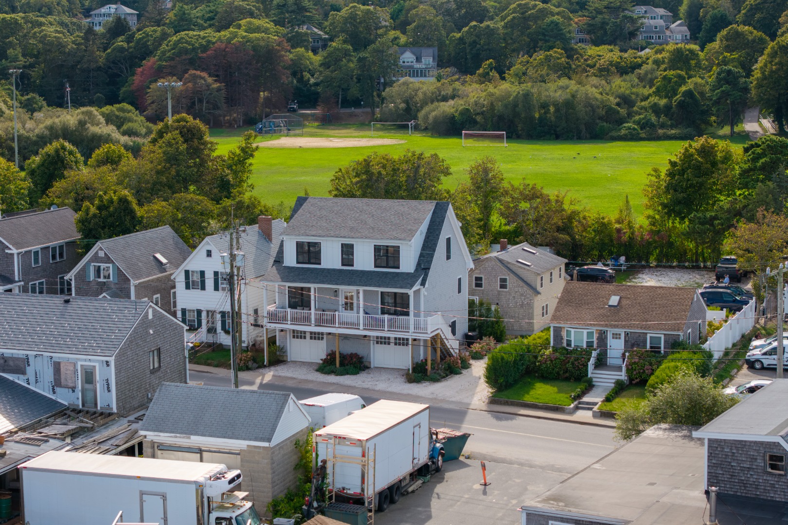 33 Lagoon Pond Road Vineyard Haven, MA 02568 - Photo 41 of 42 an aerial view of a house with a garden and swimming pool