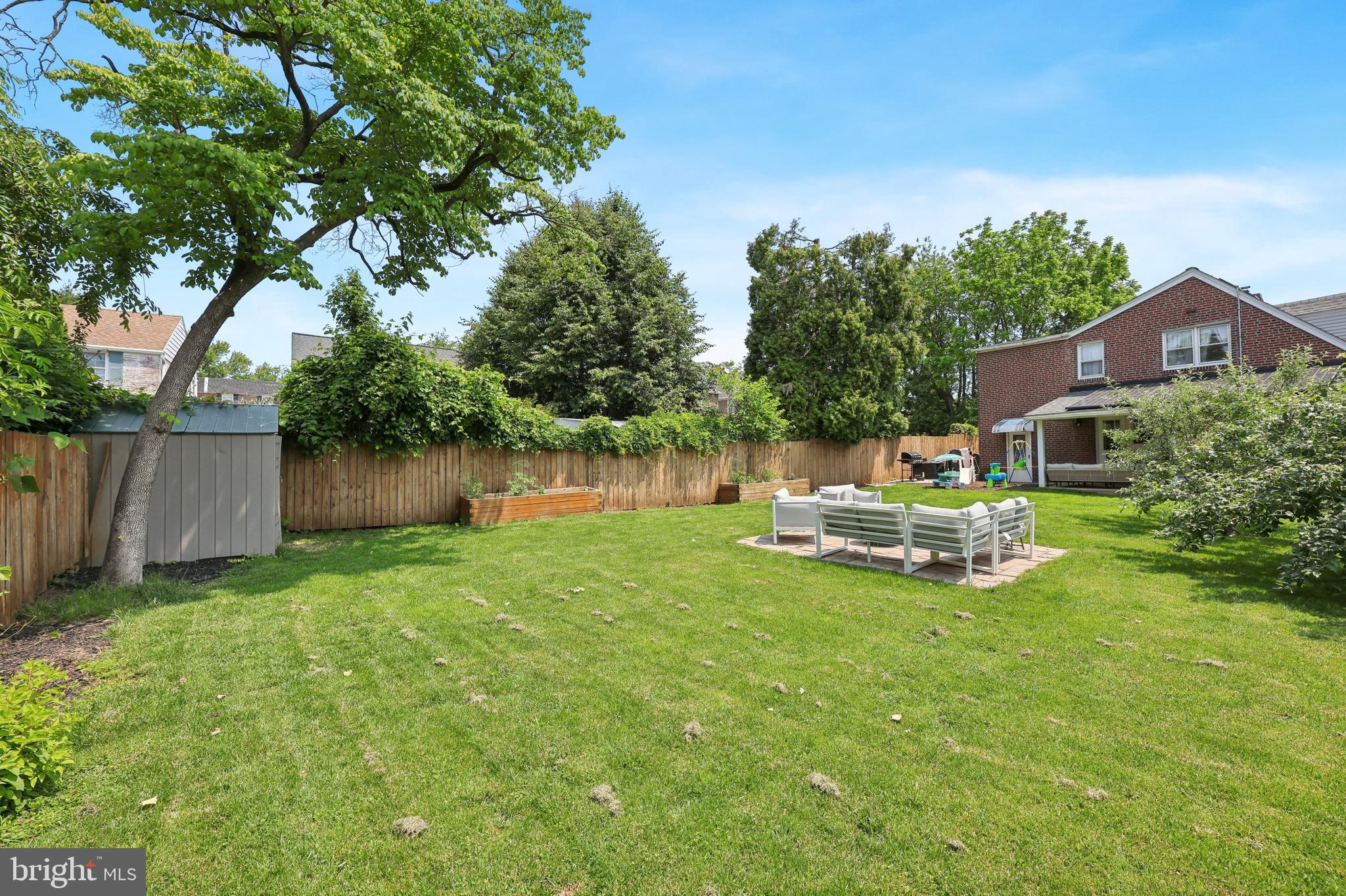 7808 Ridge Avenue Philadelphia, PA 19128 - Photo 18 of 18 a view of a house with backyard sitting area and garden
