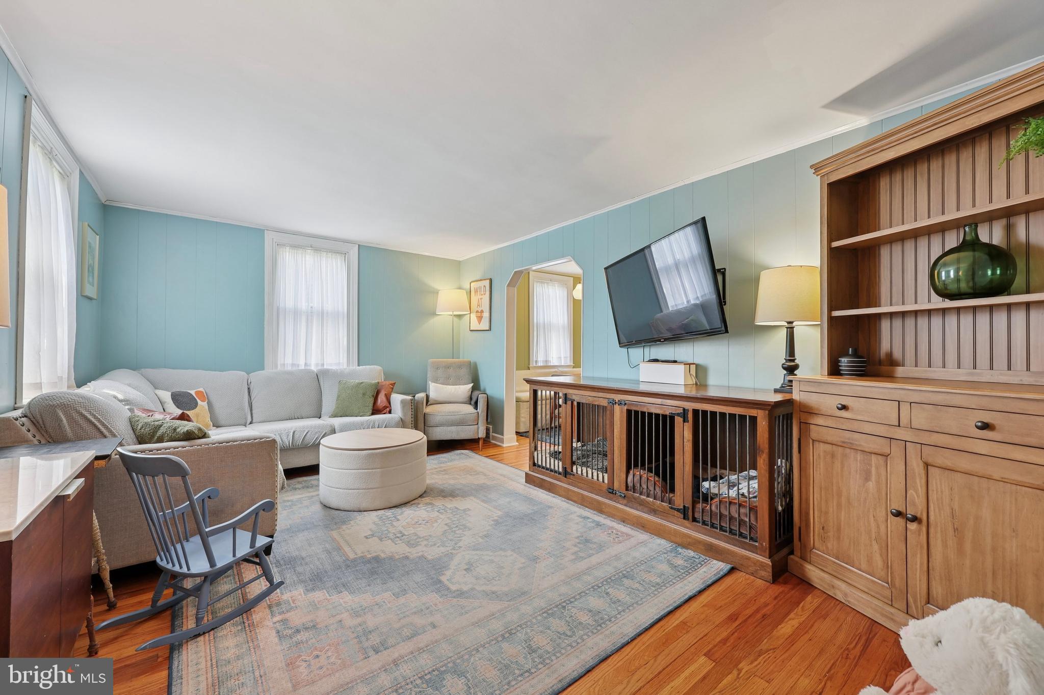7808 Ridge Avenue Philadelphia, PA 19128 - Photo 2 of 18 a living room with furniture and a flat screen tv