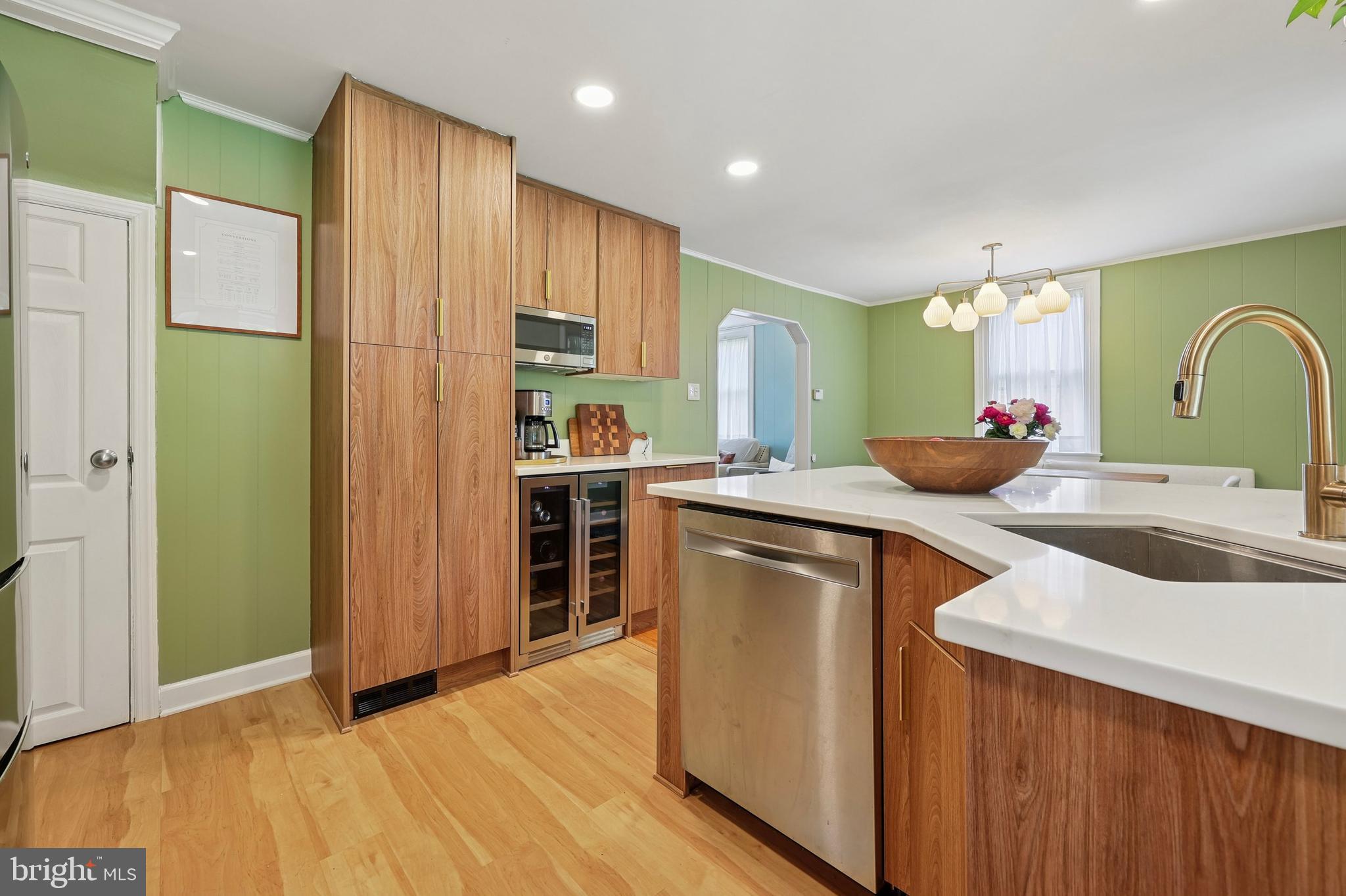 7808 Ridge Avenue Philadelphia, PA 19128 - Photo 8 of 18 a kitchen with stainless steel appliances a sink cabinets and wooden floor