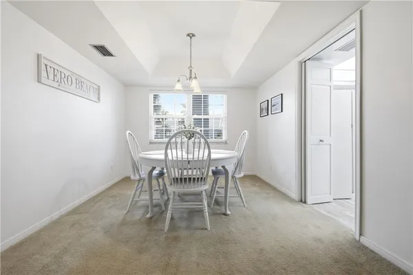 a bedroom with a bed and a night stand