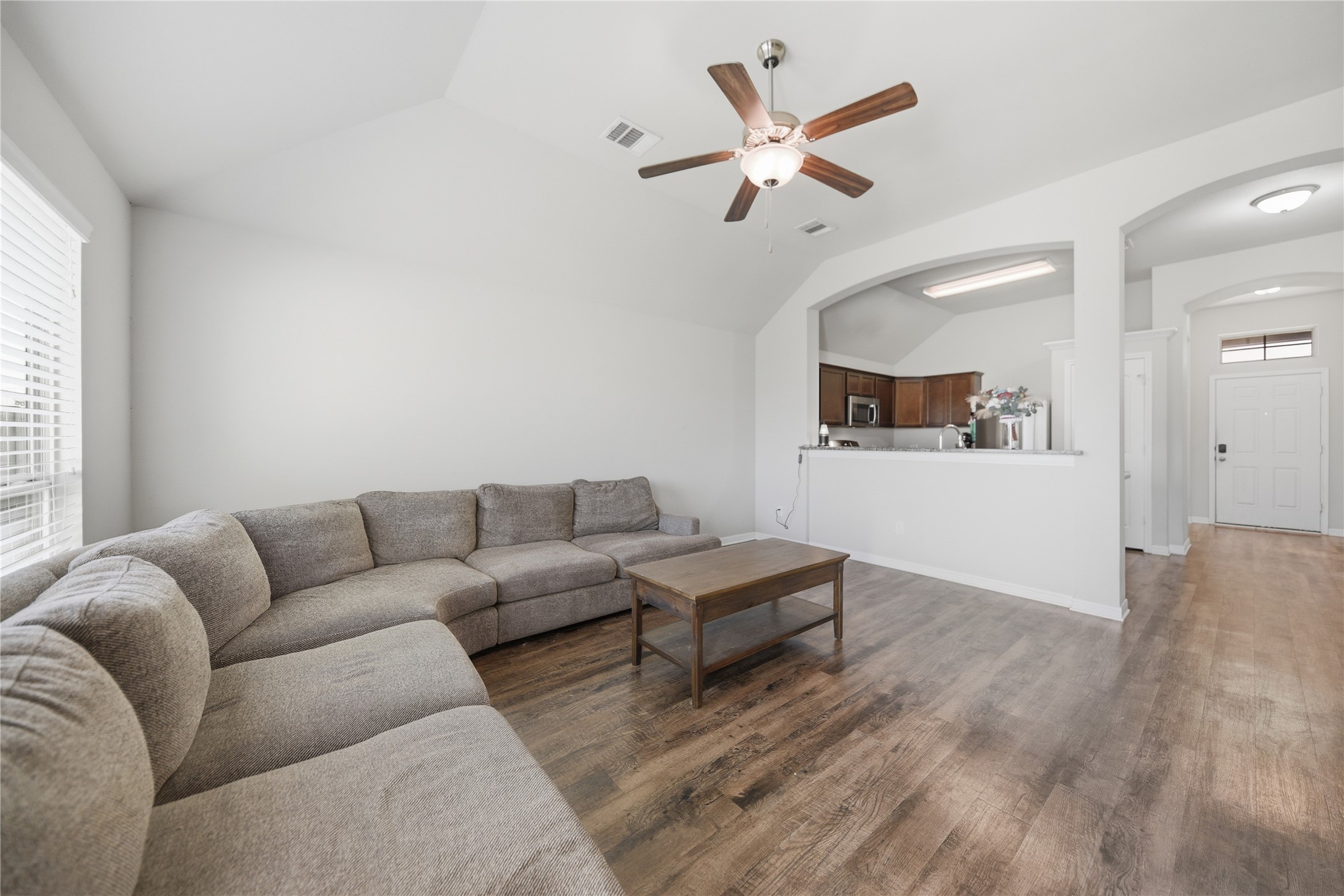 808 Mockingbird Street Navasota, TX 77868 - Photo 7 of 19 a living room with furniture and a wooden floor