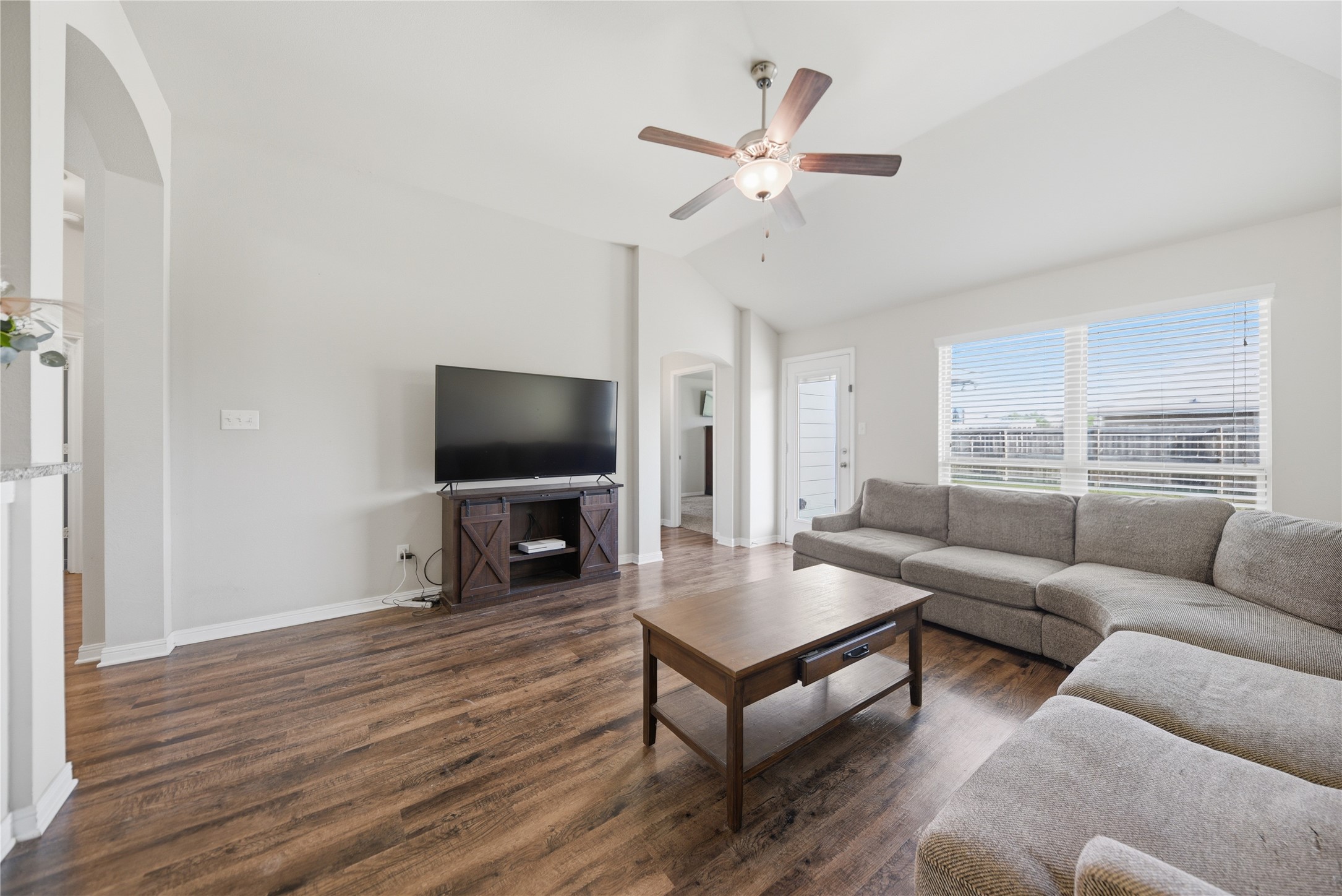 808 Mockingbird Street Navasota, TX 77868 - Photo 8 of 19 a living room with furniture and a flat screen tv