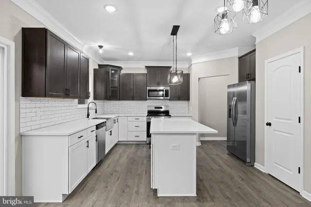 a kitchen with a sink and cabinets