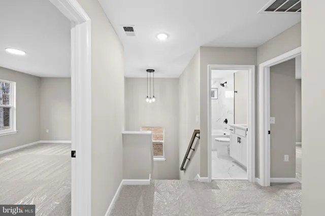 a bathroom with a glass door shower