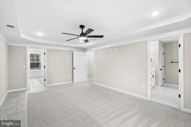 a bathroom with a tub sink toilet and mirror