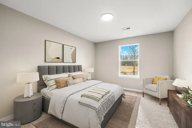 a bedroom with bed and window