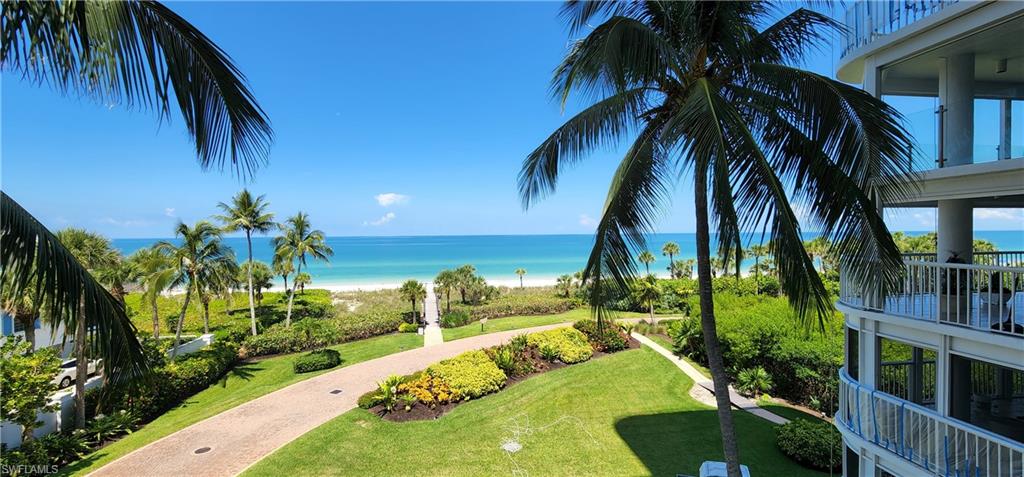 20 Seagate Drive, Unit 301 Naples, FL 34103 - Photo 1 of 29 a view of a yard with palm trees