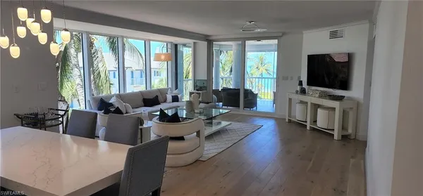 a living room with fireplace furniture and a flat screen tv