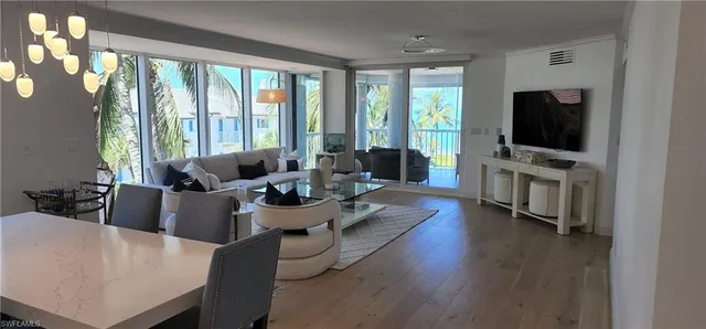 a living room with fireplace furniture and a flat screen tv