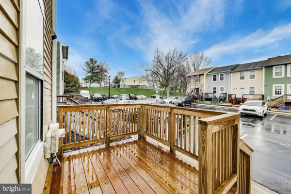 a view of a house with wooden deck