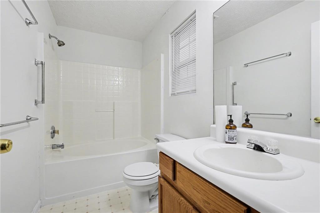 4836 Odessa W Inlet Northwest Acworth, GA 30101 - Photo 15 of 20 a bathroom with a sink toilet and shower