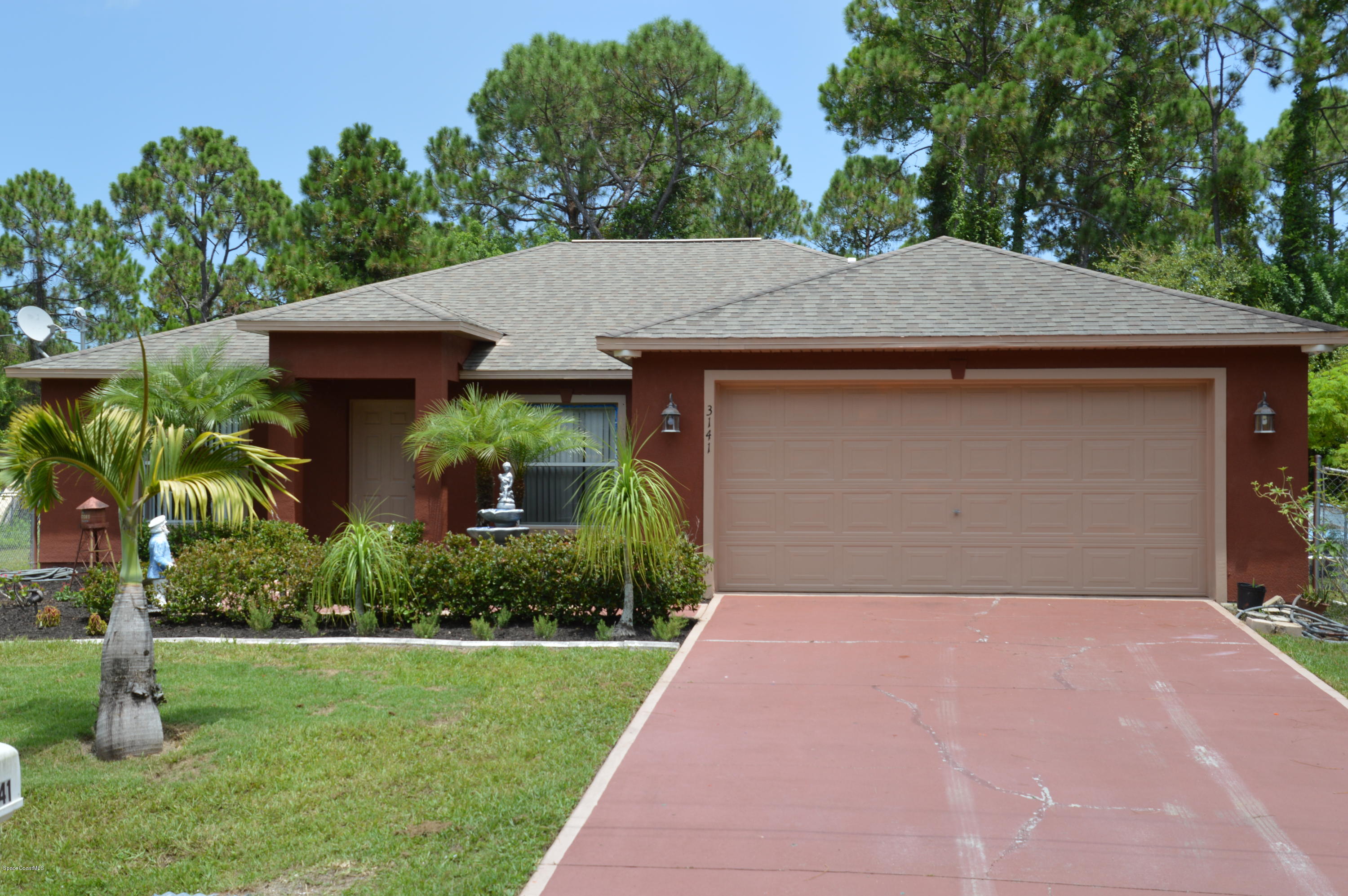 3141 Aspen Road Southeast Palm Bay, FL 32909 - Photo 2 of 24 2 - Front with garage