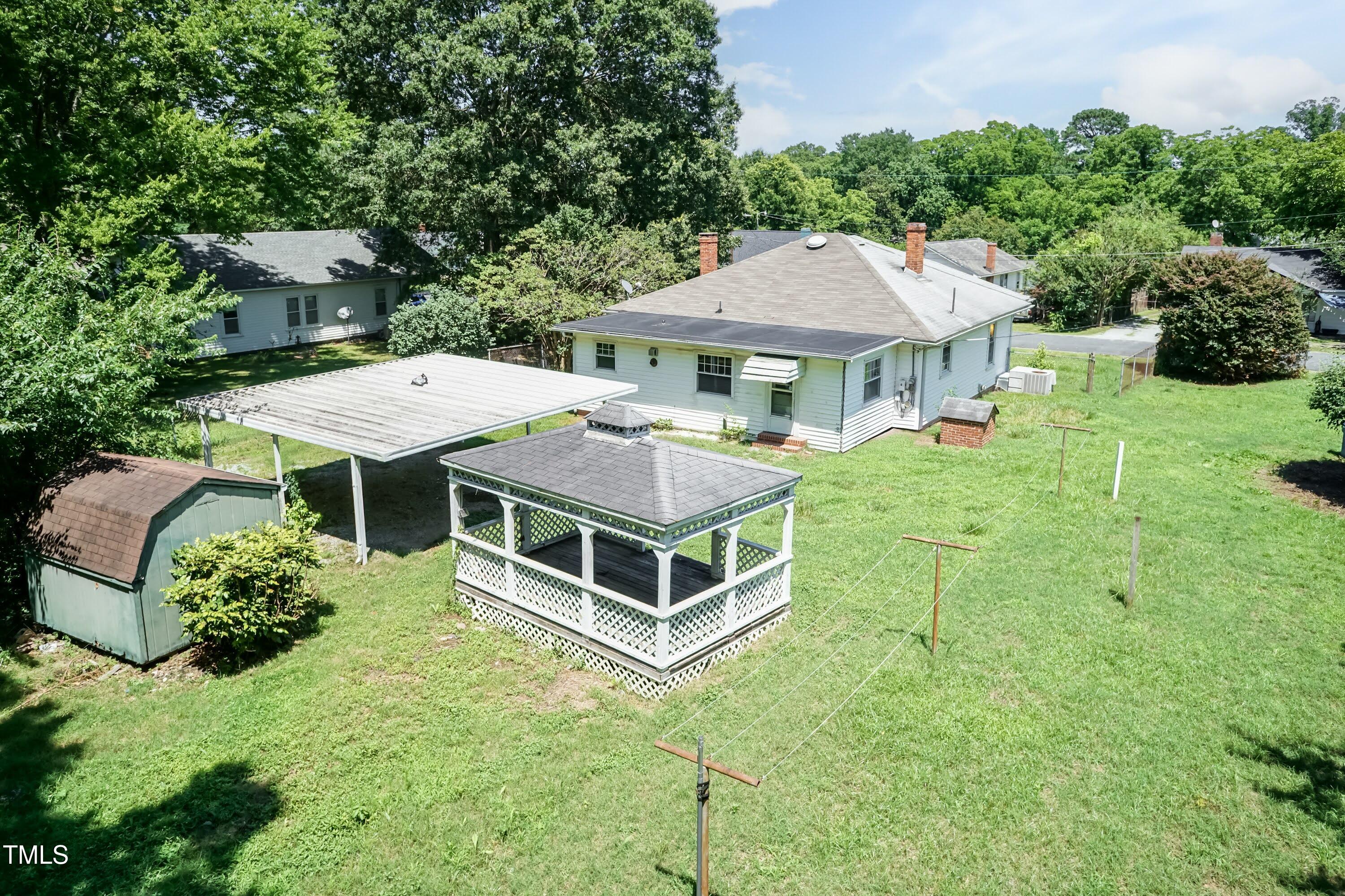 310 Spring Street Durham, NC 27703 - Photo 11 of 43 a aerial view of a house with backyard and pool