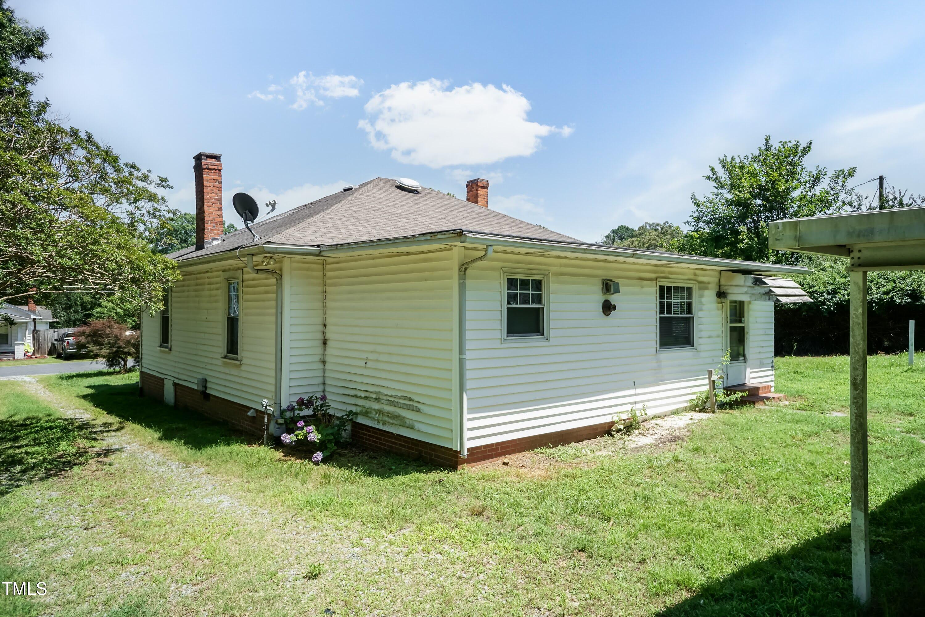 310 Spring Street Durham, NC 27703 - Photo 14 of 43 a front view of a house with a yard