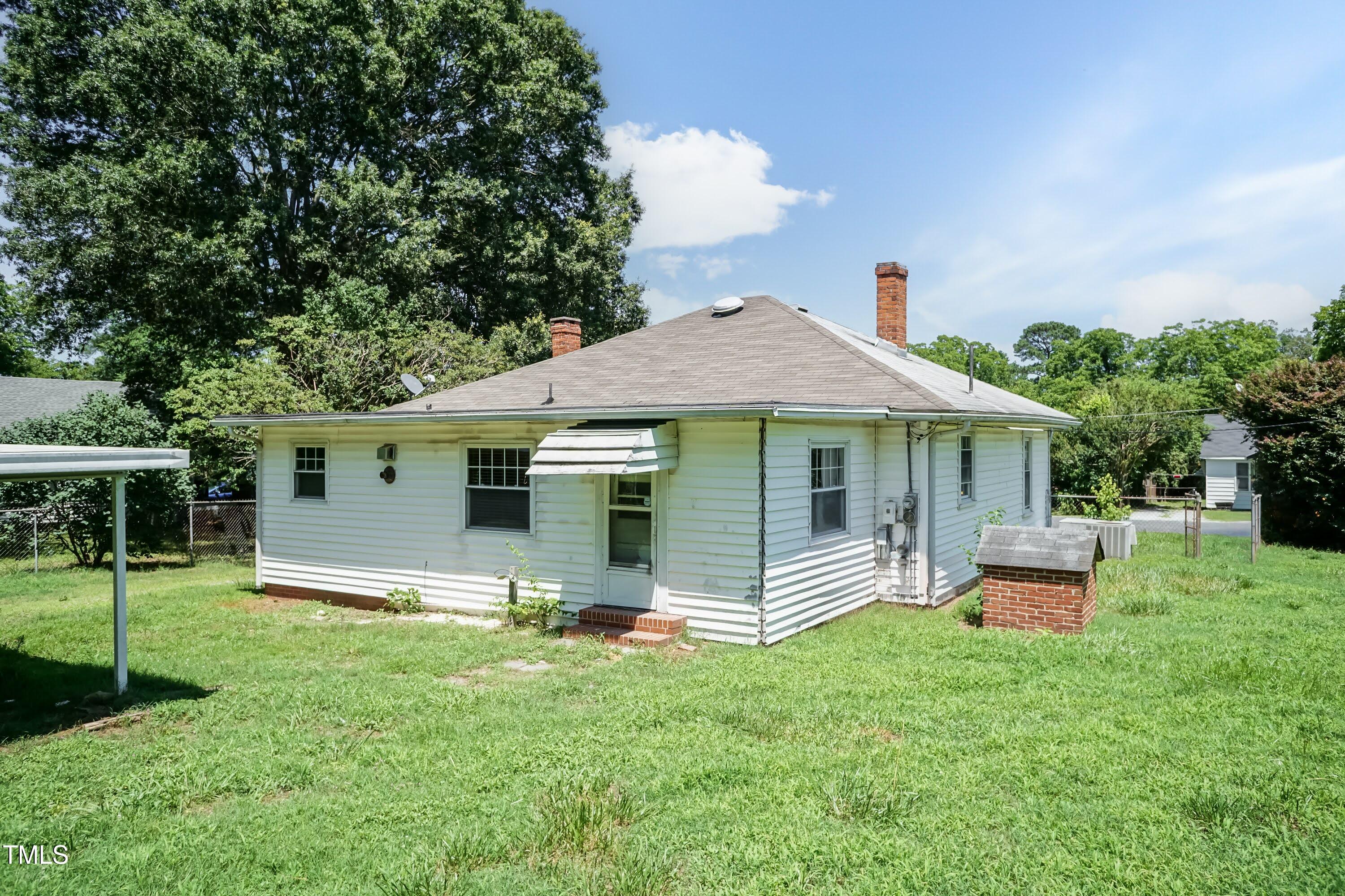 310 Spring Street Durham, NC 27703 - Photo 15 of 43 a front view of a house with a garden
