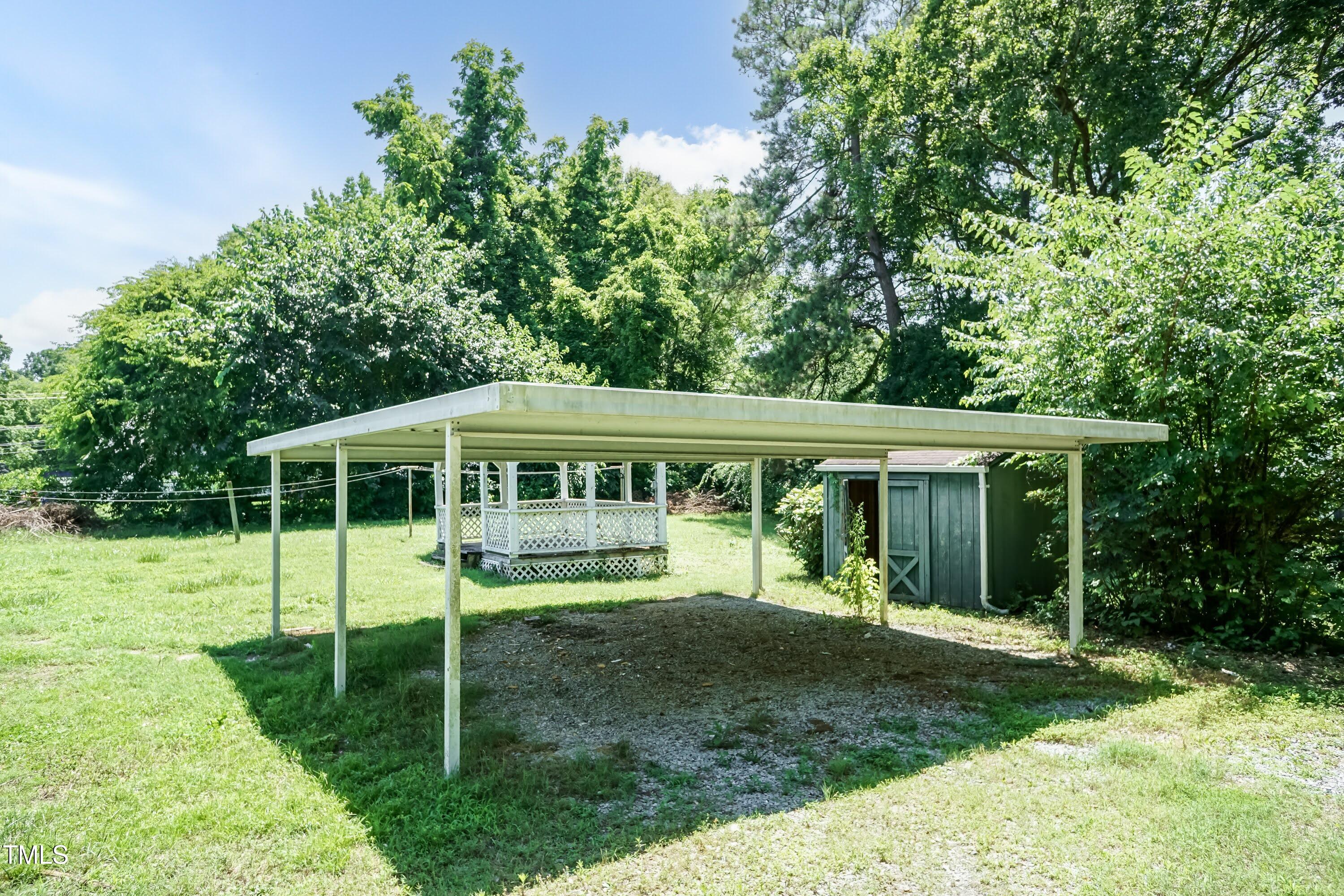 310 Spring Street Durham, NC 27703 - Photo 19 of 43 a backyard of a house with yard table and chairs