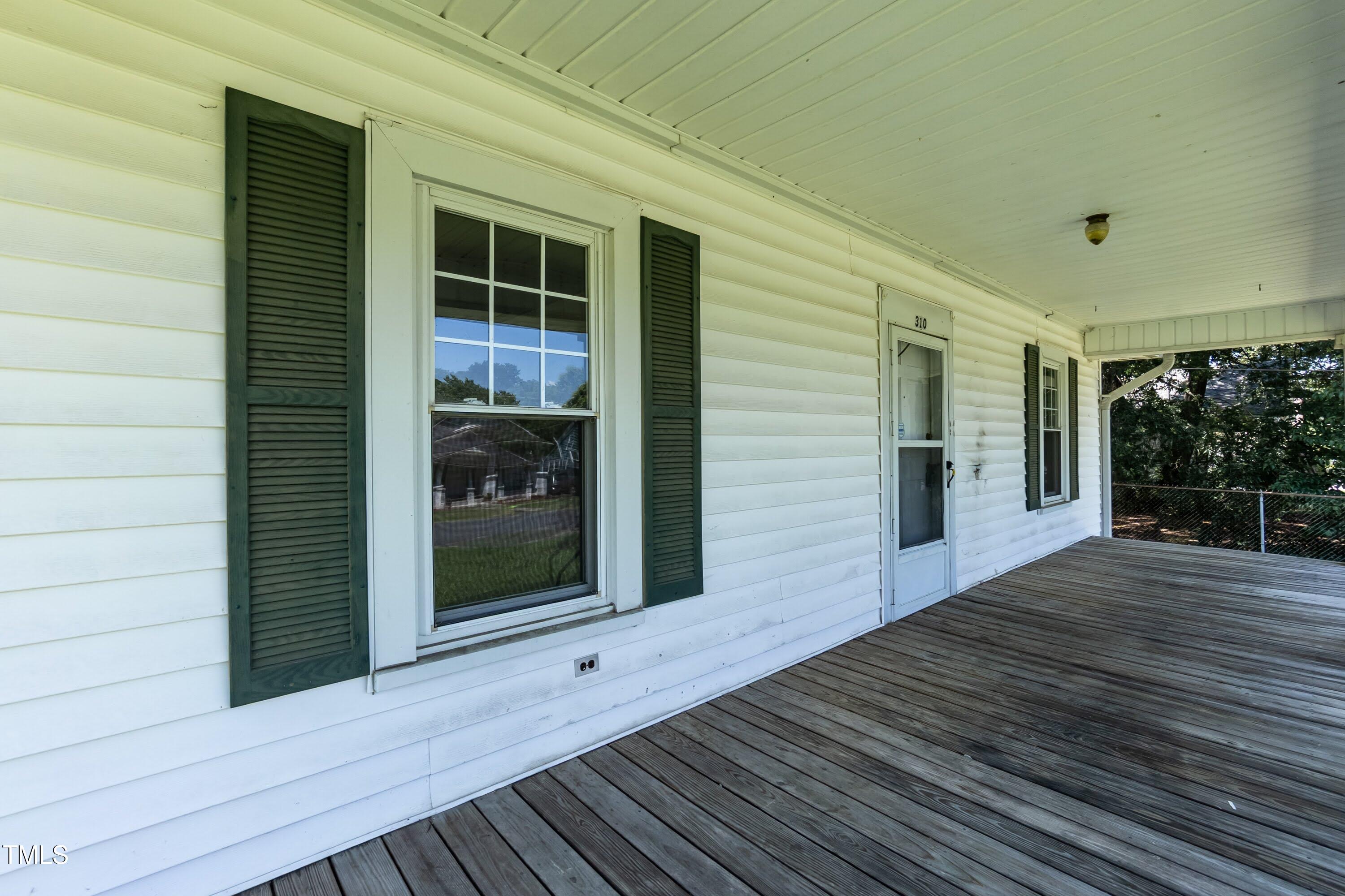 310 Spring Street Durham, NC 27703 - Photo 22 of 43 a view of a house with a deck