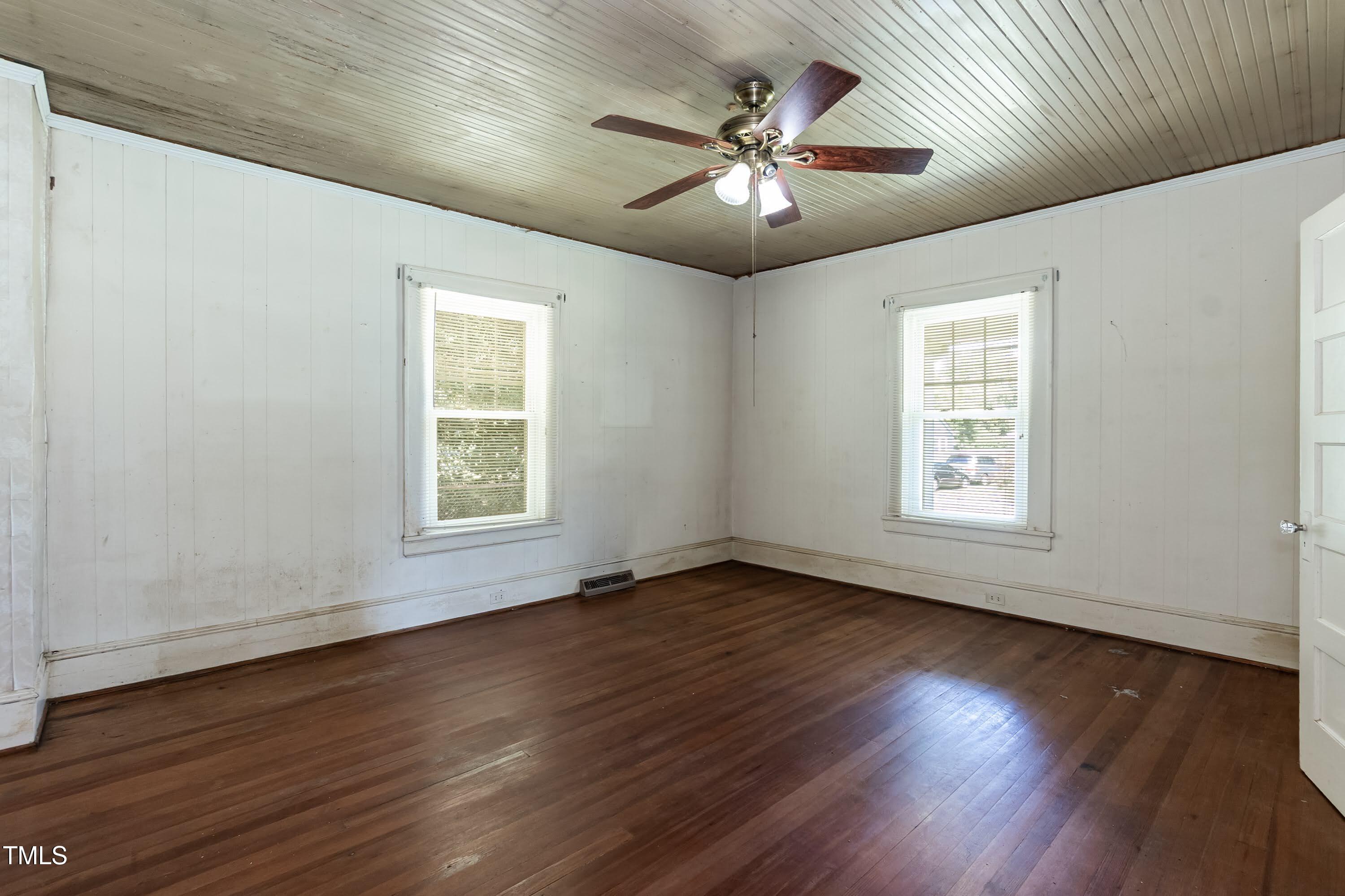 310 Spring Street Durham, NC 27703 - Photo 30 of 43 a view of an empty room with wooden floor and a window