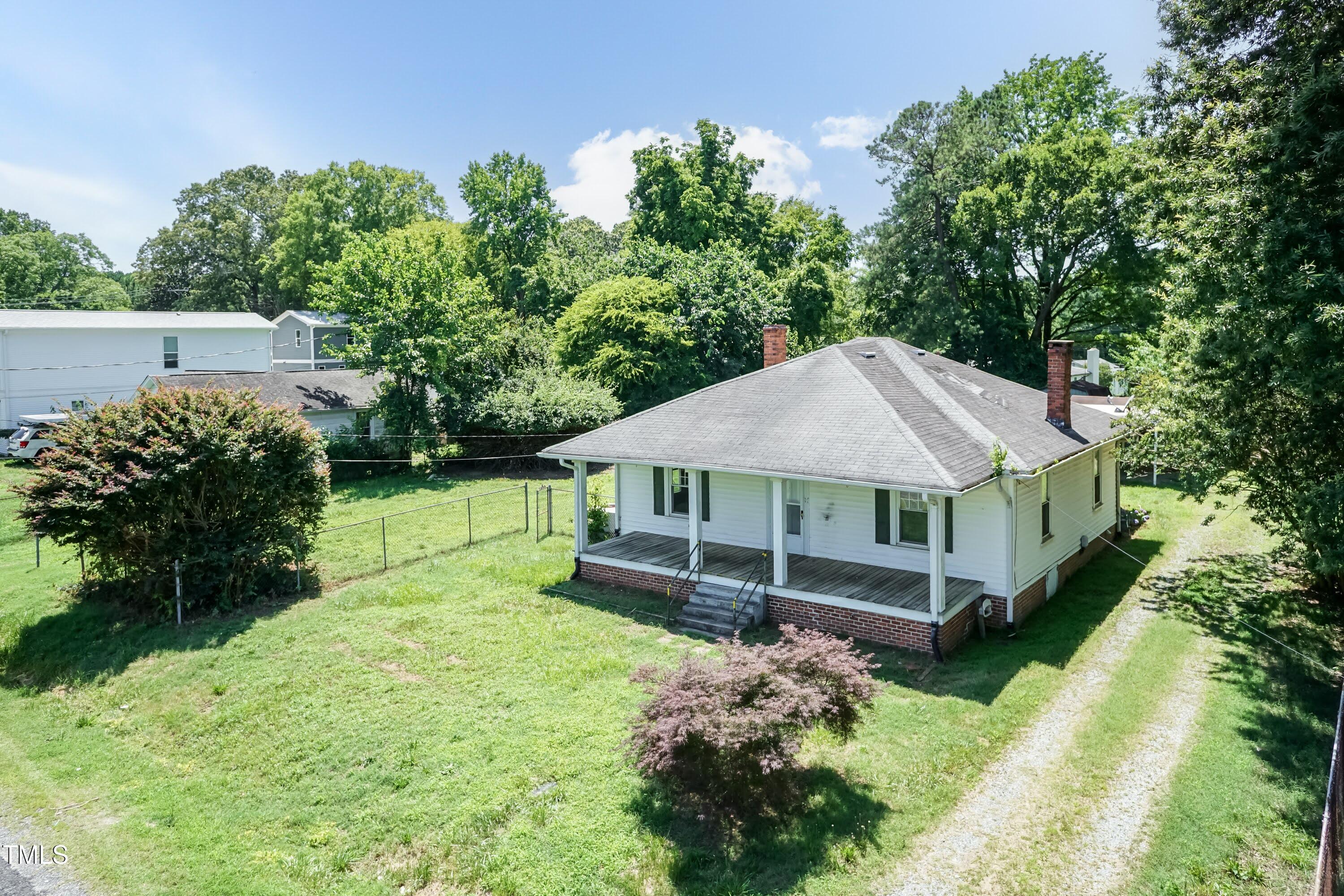 310 Spring Street Durham, NC 27703 - Photo 3 of 43 a view of a house with a yard deck and a garden