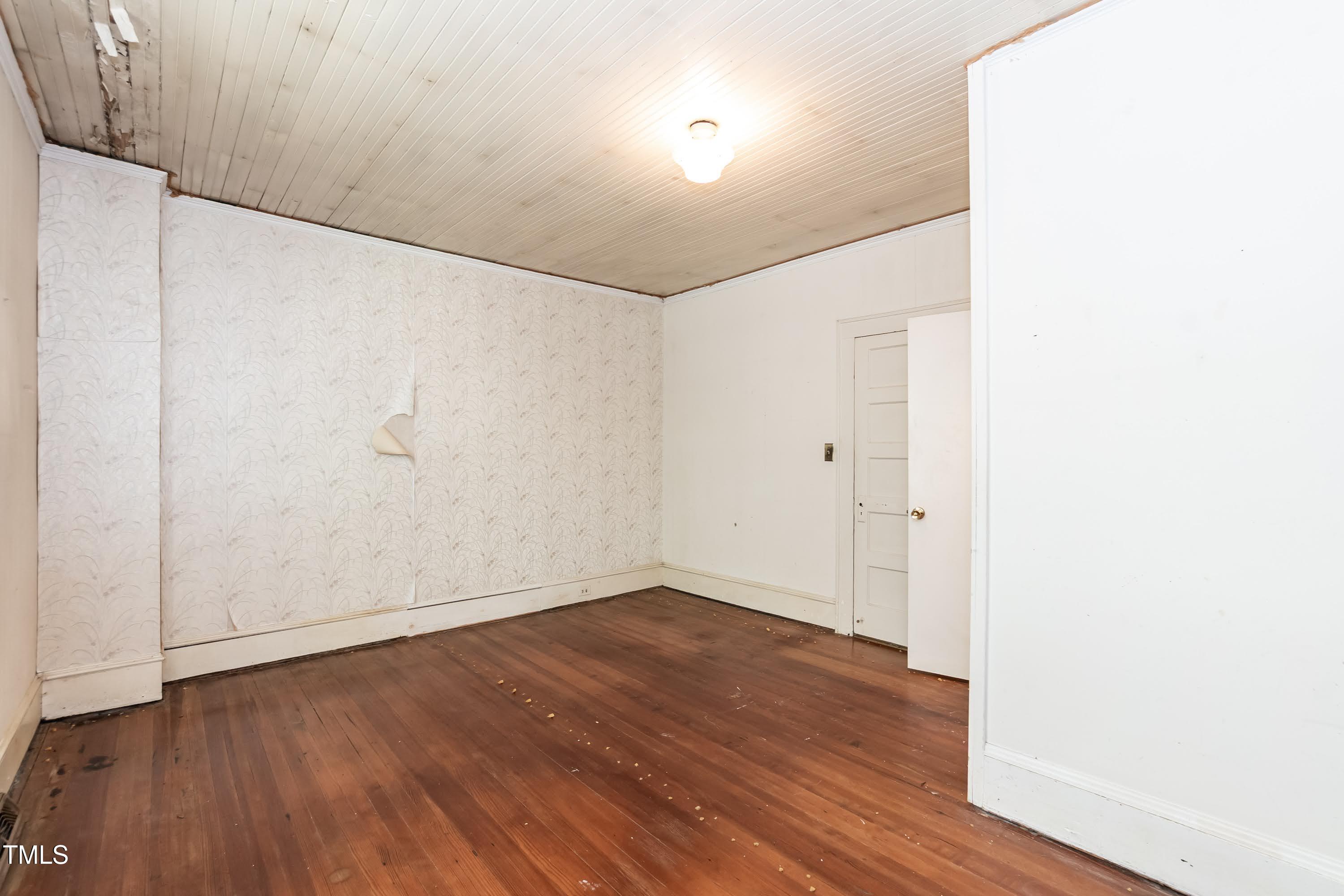 310 Spring Street Durham, NC 27703 - Photo 33 of 43 a view of an empty room with wooden floor