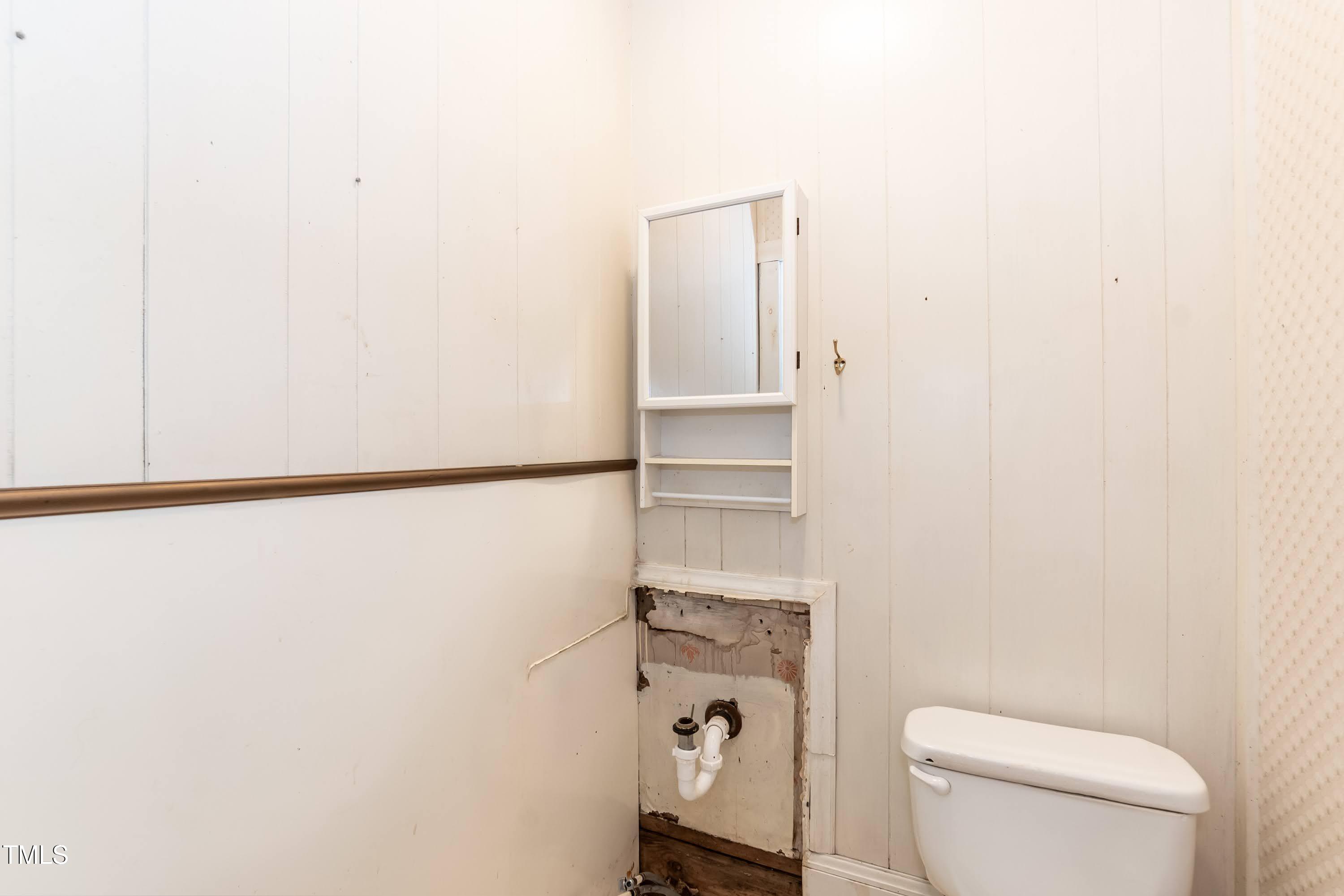 310 Spring Street Durham, NC 27703 - Photo 34 of 43 a bathroom with a toilet and a shower